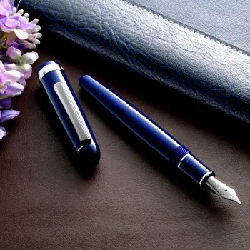 scene with the pen on a wooden desk and stationery accessories