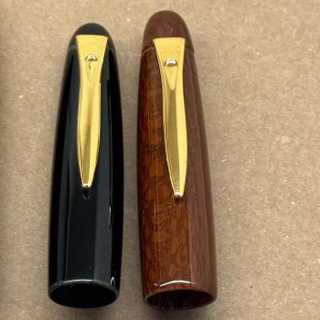 comparative sizes between platinum izumo lacewood cap that is bigger than izumo urushi