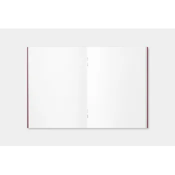 passport size blank notebook open showing plain white pages
