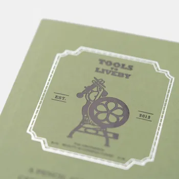 la portada muestra la prensa tipográfica que preside la tienda física de taipei