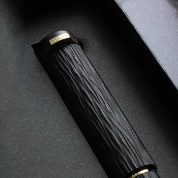 lose up of the ebonite surface showing natural grain and vertical engraving texture