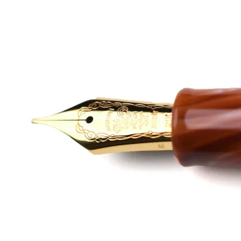 close up of 21k gold nib with weathervane engraving