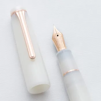 close up of 21k gold nib with weathervane engraving with a cap