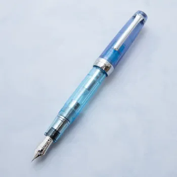 nagasawa aqua planet fountain pen opened showing the 14k gold nib with weathervane engraving