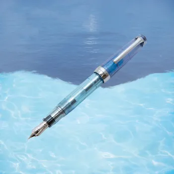 nagasawa aqua planet fountain pen in a water-inspired lifestyle scene with blue reflections