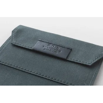 logo detail on the cotton zipper case of the traveler’s notebook 20th anniversary set
