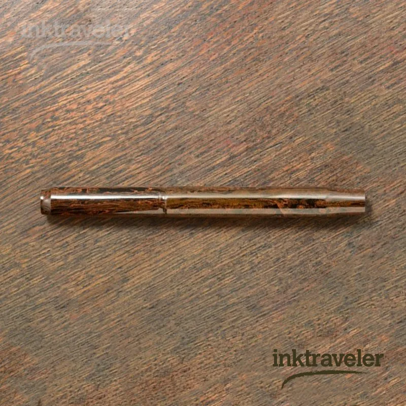 eboya yuzen nichibo sunset fountain pen showing orange marbled ebonite body and gold nib